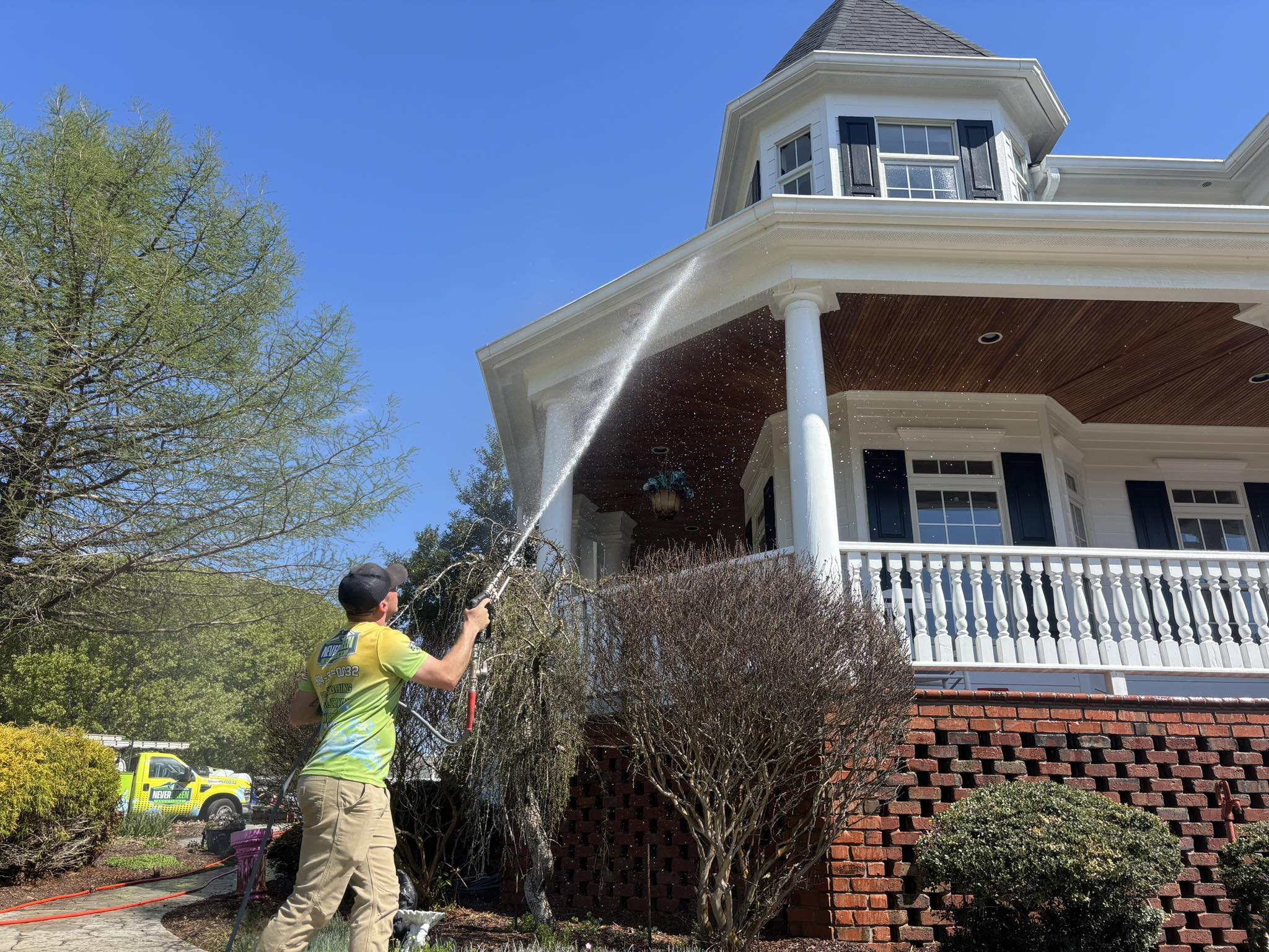 Nevergreen Employee Spraying House
