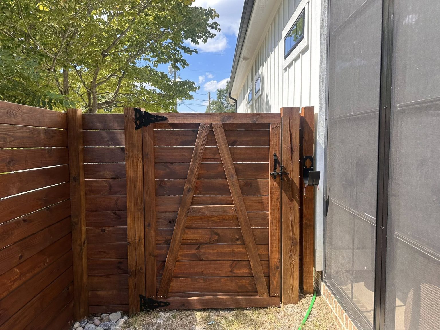 Fence gate cleaned and stained